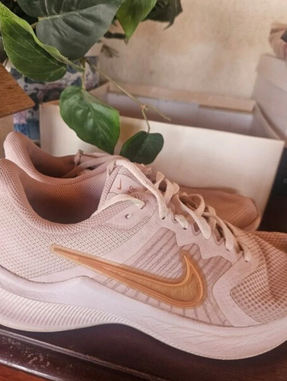 Nike Women's Pale Pink Running Sneakers with Gold Swoosh